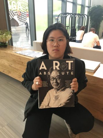 Dear Liu ’19 displays an art magazine from an artist whom the students met during the China Hotchkiss Art Program.