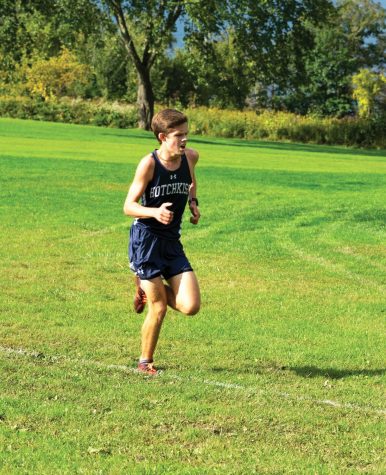 Andrew Sidamon-Eristoff ’19 tackles a hill at home cross country meet.