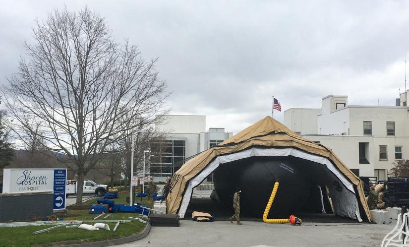 Members of the Connecticut militia set up a temporary field hospital in the Sharon Hospital parking lot for recovering COVID-19 patients this past Friday.