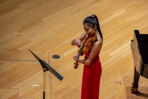 Wang performs during an Instrumental Recital in Elfers Hall.