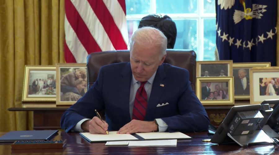 Biden signs an executive order related to the Affordable Care Act.