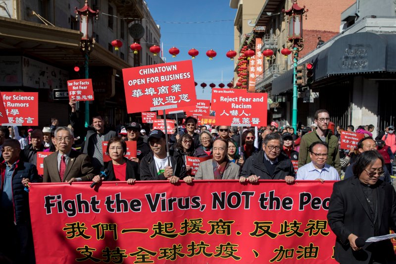 Chinatown residents along with local and state officials protest against racism against the Chinese community during a march in San Francisco on February 29. 
