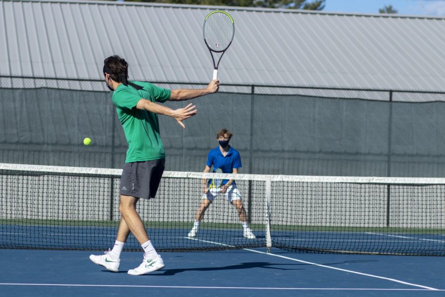 Beckwith hits a backhand on the courts this spring. 