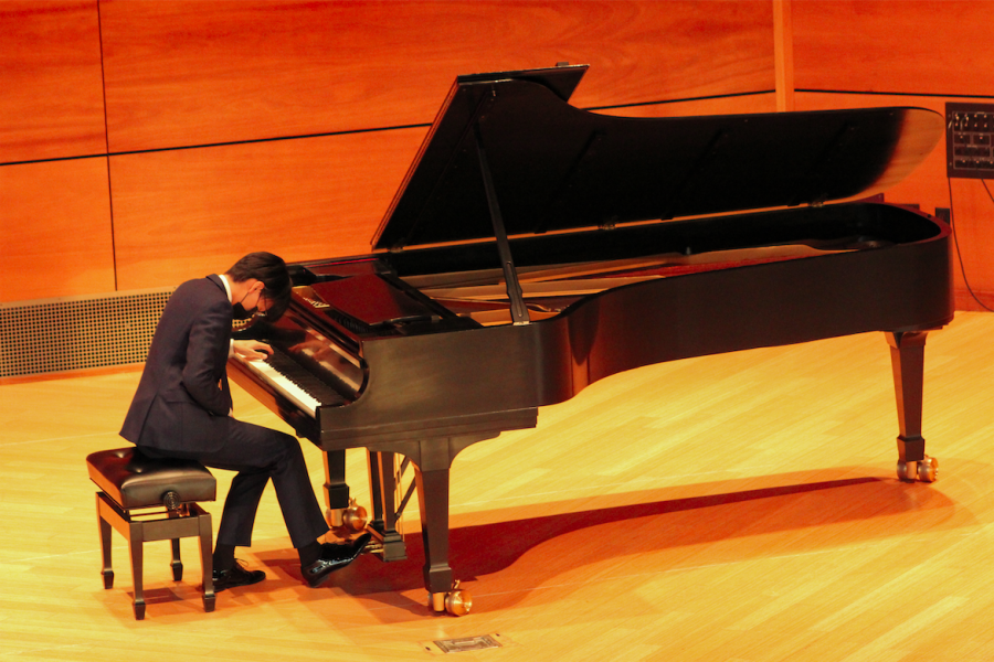 Kenny Zhang 22 plays Franz Liszts Paraphrase on Verdis Rigoletto during the recital on April 13. 