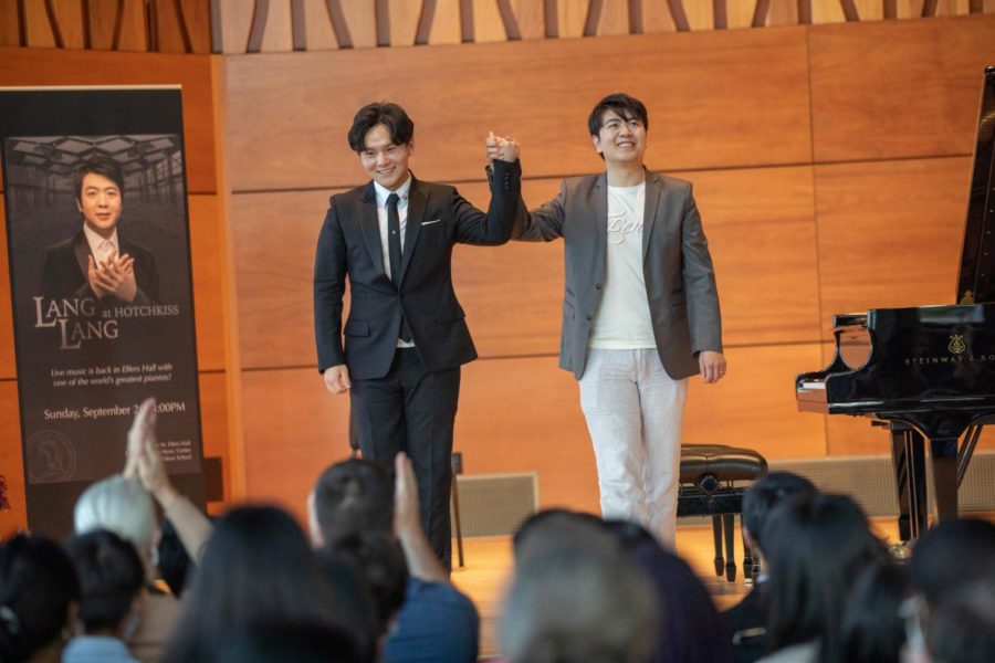 The crowd applauds after Chen and Lang's performance.