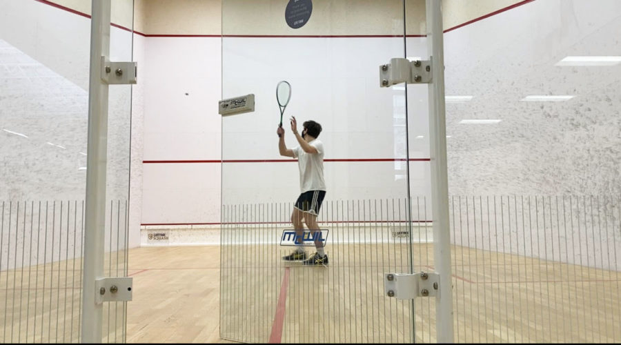 John Nicholason 22 practices in the Cullman squash courts. 