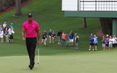 Woods prepares for an important putt at the Masters in Augusta, Georgia.