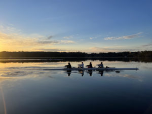 The rowing team practices before dawn on Lake Wononscopomuc.