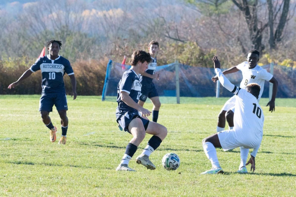 Brown dribbles past a Westminister defender during the 2022-23 season.