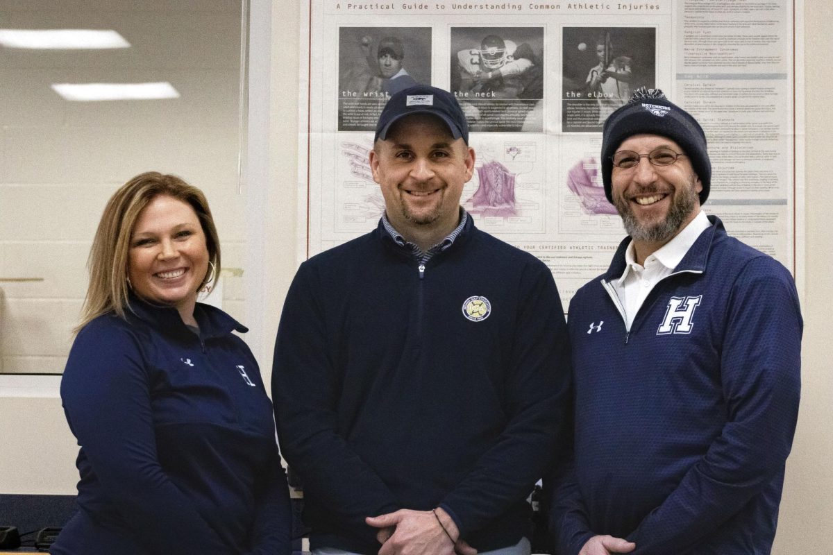 From left to right: Mrs. Danielle Turner 03, Mr. Darren Yoos, and Mr. Jon Russillo work in the school’s Athletic Training Office.