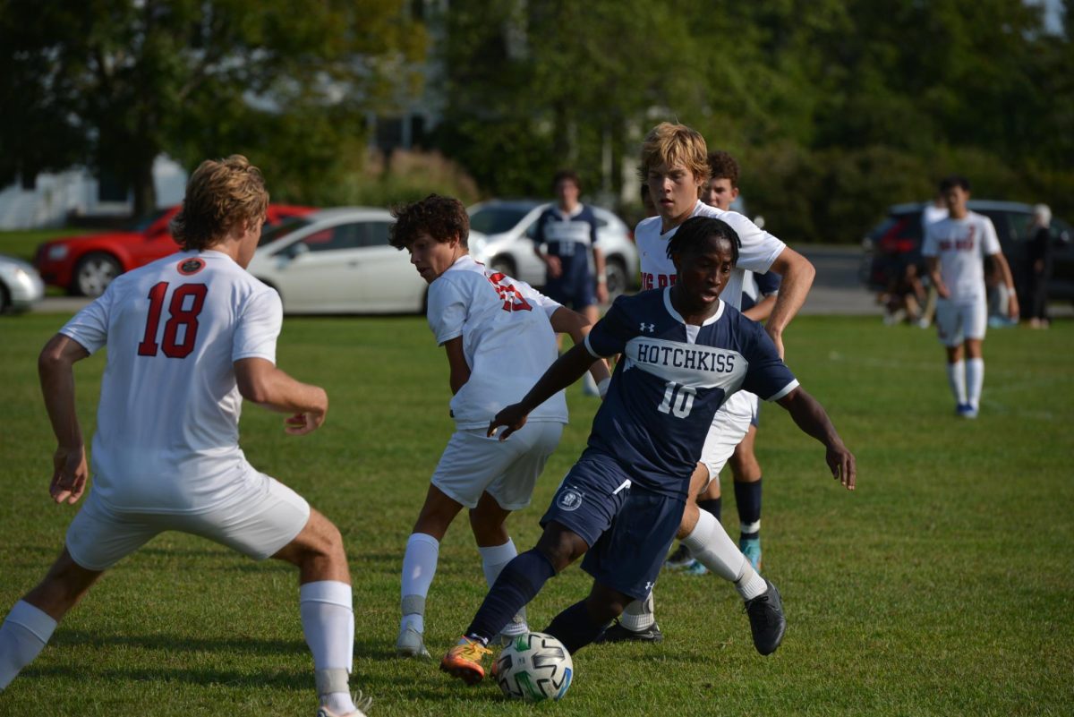 Mo Nuhu ’23 dribbles during the season-opener against Lawrenceville.