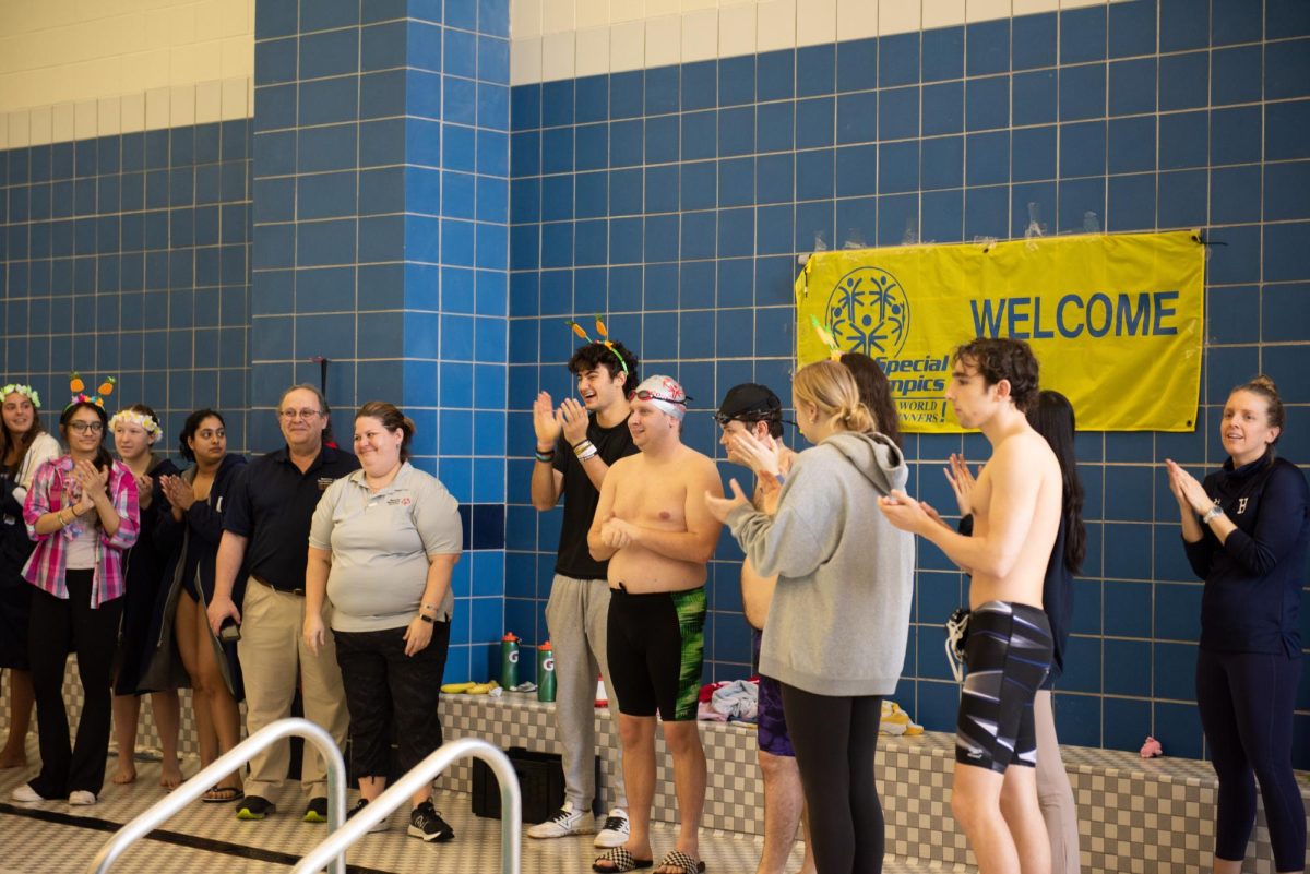 Special Olympic swimmers, staff, and club board members gather at Hixon Pool.