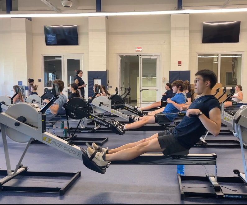 Varsity Rowing practices on the ergs at the beginning of the spring season.
