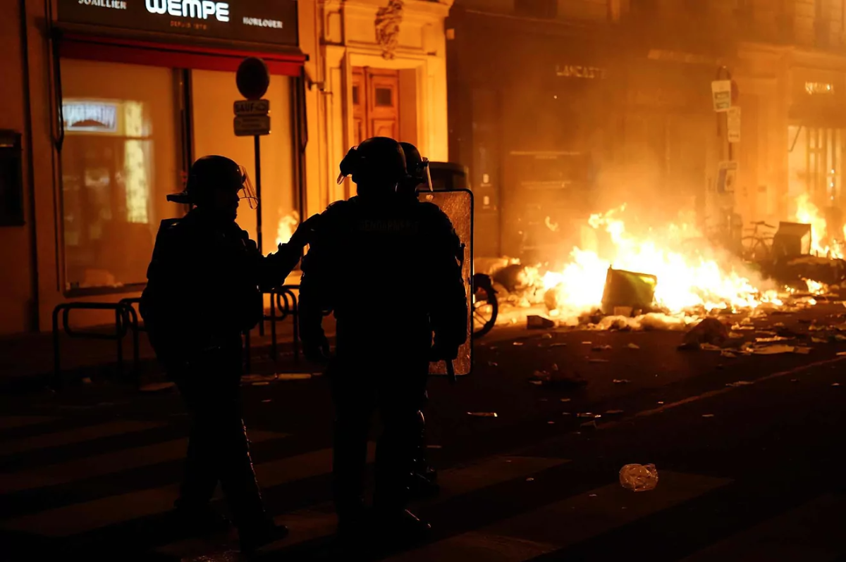 French police respond to rioters.