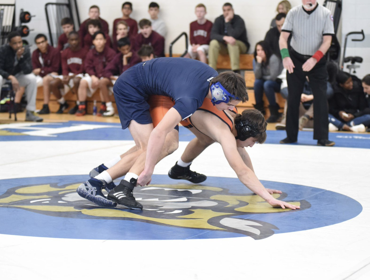 Johnson competes in a wrestling match during his Lower Mid year.