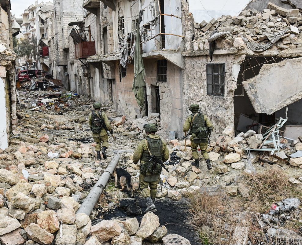 Soldiers search through rubble for survivors and bodies in Syria.