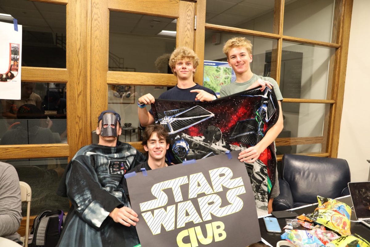 Shayne Bjorn 23, Caleb Eddy 23, Alex Shtoryn 24, Wyatt Towner 24 enlist students to join the Star Wars Club.