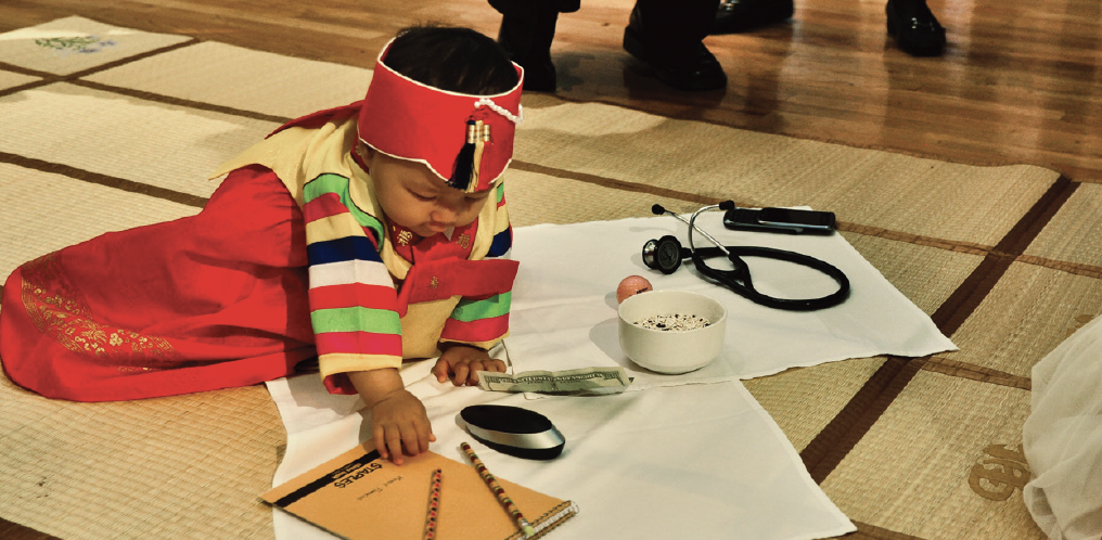 Evelyn celebrating her Doljanchi celebration while wearing her first hanbok.