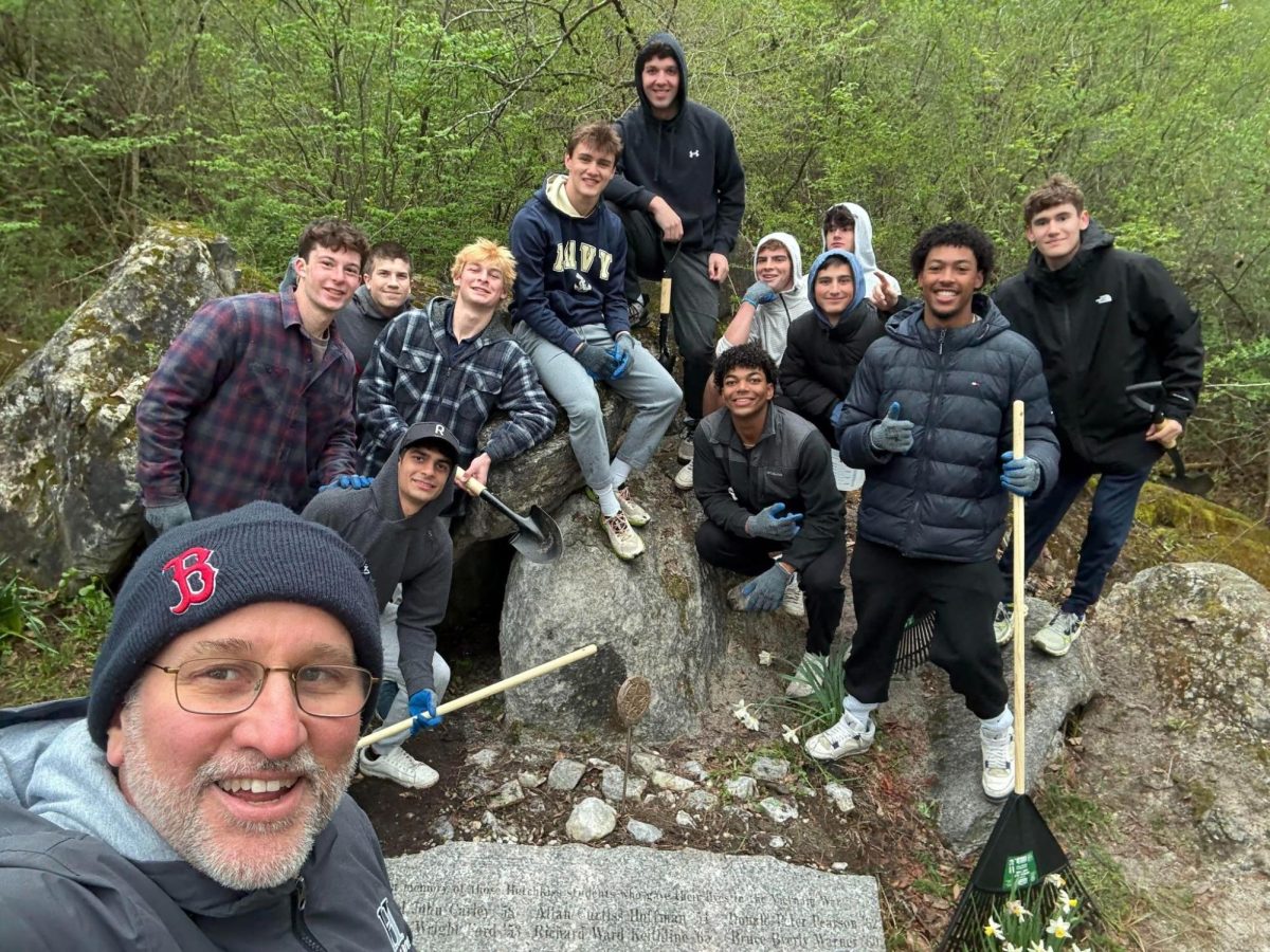 Mr. Keith Moon, Henry Rowe ’27, and a group of students cleaned up the Vietnam Memorial for Eco Day this year.